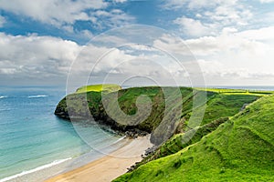 Sheep grazing near Silver Strand, a sandy beach in a sheltered, horseshoe-shaped bay, situated at Malin Beg, near Glencolmcille,