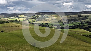 Sheep Grazing on Rolling Hills of British Countryside