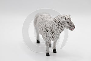 sheep miniature figurine toy on a white background