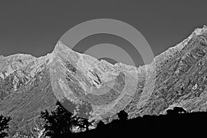 Sheep Shadows in Foreground with Jagged Rugged Mountain