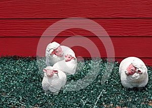 Sheep statues on green artificial grass