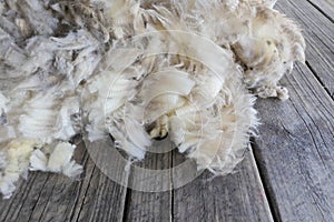 Sheep wool on a wooden table