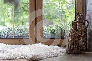 Sheepskin rug and home decor on wooden windowsill