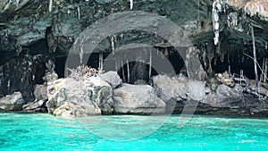 Sheer cliffs, blue water and a Viking cave. Phi Phi Islands, Thailand.