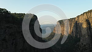 Sheer cliffs of Tazi Canyon in Turkey in the morning. Aerial drone view flying among rocky mountains