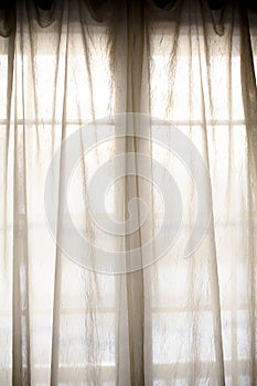 Sheer fabric window curtain with filtered light