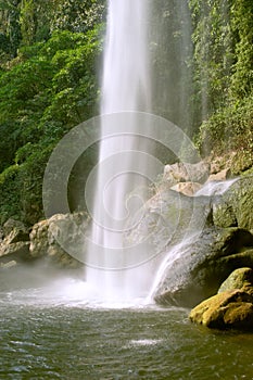 Sheer waterfall in countryside photo