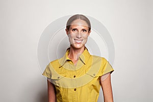 Sheerful mature woman smiling on white background, portrait