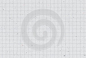 Sheet of blank grid notebook recycled paper background with inclusions of recycled paper particles.