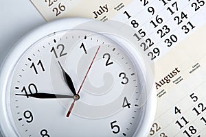 Sheet of a calendar with clockface photo