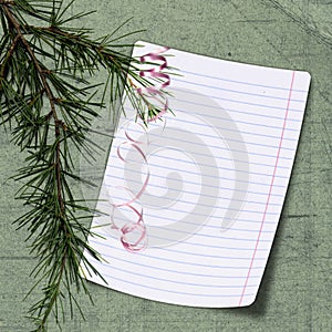 Sheet with christmas tree on green background photo