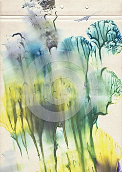 A sheet of decorative old vintage paper filled with blue, green and yellow watercolor paint. Grunge artistic background with multi