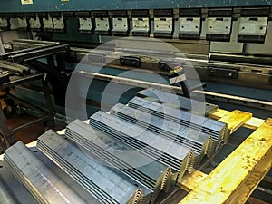 Sheet metal bending in factory by bending mashine.