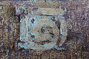 Sheet metal hatch for cleaning soot..Old rusty door with old layers of paint.