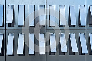 Sheet metal sheets with cut out rectangular sections. Abstract view of the building facade photo