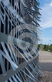Sheet metal sheets with cut out rectangular sections. Abstract view of the building facade photo
