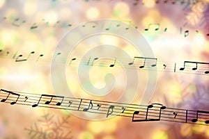 Sheet with music notes as background, closeup. Christmas songs