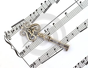 Sheet music staff & old key with treble clef