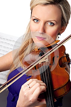 Sheet music, violin and portrait of woman in studio, professional orchestra musician on white background. Art, musical