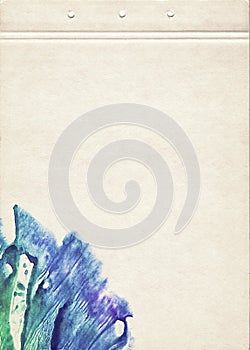 A sheet of notebook stained with blue watercolor spot. Artistic template for creative design.