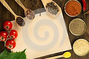 Sheet old vintage paper with spices on wooden background. Healthy vegetarian food. Recipe, menu