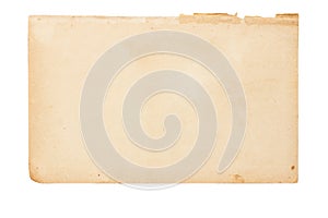 Sheet of old yellowed paper with uneven torn edges on white isolated background