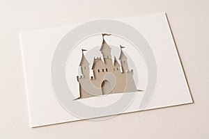 A sheet of paper with a cut-out silhouette of a lock.