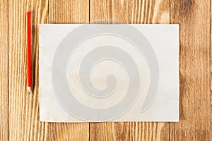 Sheet of paper lying on wooden table