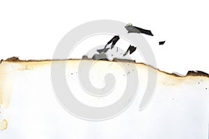 Sheet of white paper with burnt edge and pieces of soot. Close up isolated on white background. Mockup for your design and idea