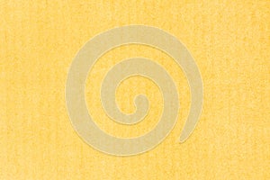 A sheet of yellow colored paper.