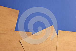 Sheets of old parchment paper on blue background, flat lay. Space for text