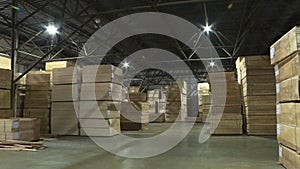 Sheets of plywood slabs are stacked in the warehouse of the woodworking plant