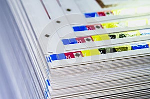 Sheets of printed products. Offset printing. CMYK press. Paper at the printing house