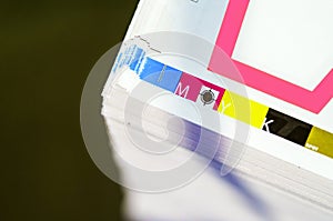 Sheets of printed products. Offset printing. CMYK press. Paper at the printing house