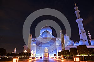 Sheikh Zayed Grand Mosque Centre Abu Dhabi illuminated at night with blue color. The white terraces.