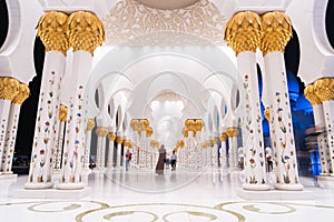 Sheikh Zayed Grand Mosque Centre Abu Dhabi illuminated at night with blue color. The white terraces.