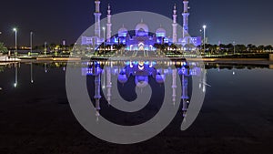 Sheikh Zayed Grand Mosque illuminated at night timelapse, Abu Dhabi, UAE.