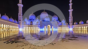 Sheikh Zayed Grand Mosque illuminated at night timelapse hyperlapse, Abu Dhabi, UAE.