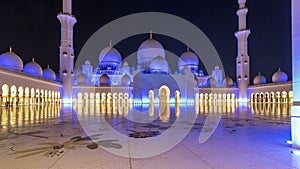 Sheikh Zayed Grand Mosque illuminated at night timelapse hyperlapse, Abu Dhabi, UAE.