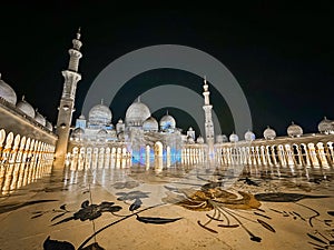 The Sheikh Zayed Grand Mosque at night, in Abu Dhabi, United Arab Emirates