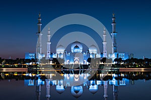 Sheikh Zayed Grand Mosque reflected on the water in Abu Dhabi emirate of UAE