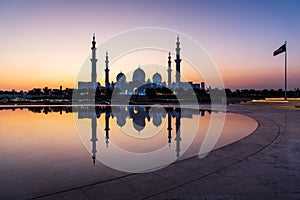 Sheikh Zayed Grand Mosque reflected on the water in Abu Dhabi emirate of UAE