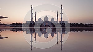 Sheikh Zayed Grand Mosque reflected on the water in Abu Dhabi emirate of United Arab Emirates