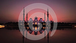 Sheikh Zayed Grand Mosque with reflection at dusk in Abu Dhabi