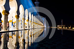 Sheikh Zayed Mosque pillars reflected in the water