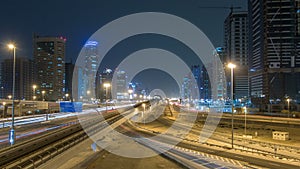 Sheikh Zayed road traffic night timelapse and Dubai Metro. Dubai, UAE.