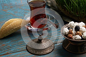 Shekerbura with glass of tea and sweet snack