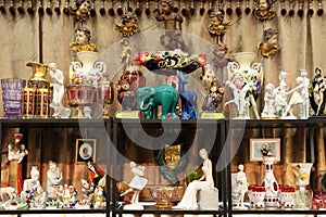 Shelf with assorted vintage figurines