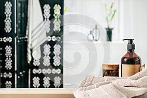 Wooden shelf with cosmetic products against bathroom interior