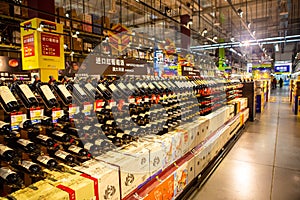 A shelf of wines in a supermarket